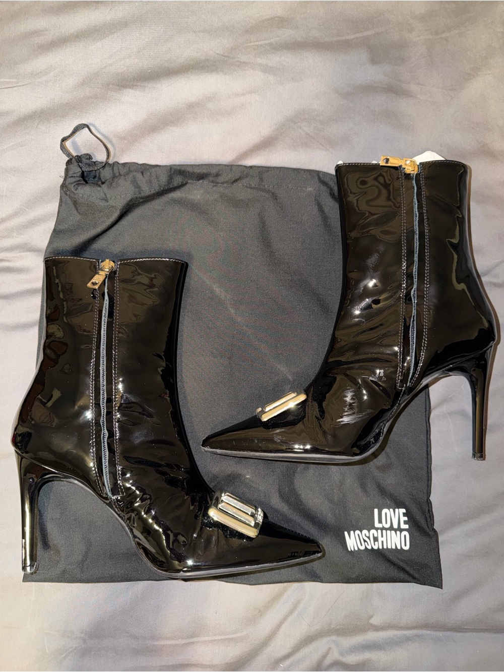 Moschino Black Patent Pointed Toe Stiletto Ankle Boots with Gold Accent
